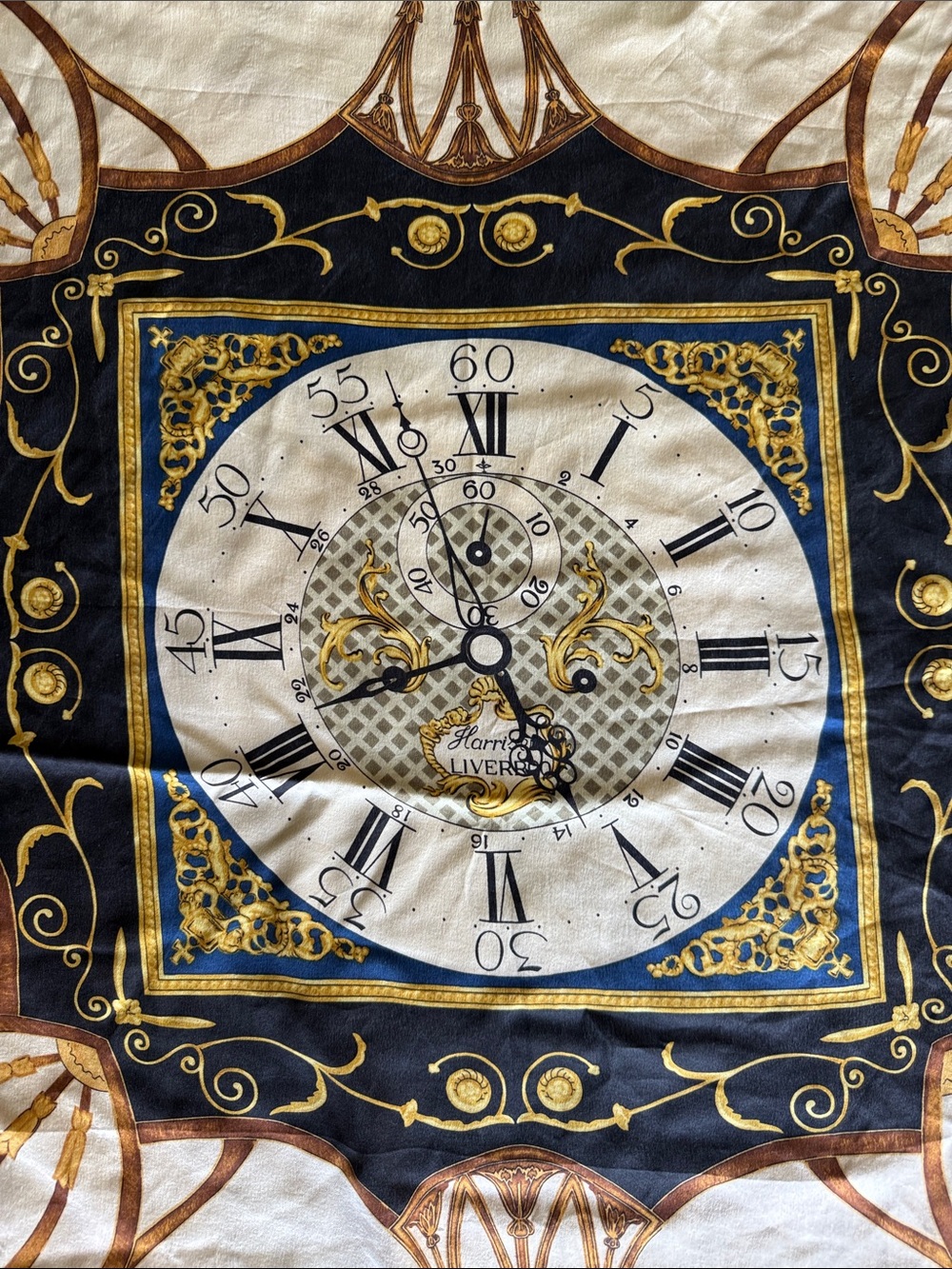 Colonial Williamsburg branded silk scarf featuring brown and gold baroque print